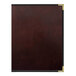 A brown leather H. Risch, Inc. menu cover with black trim.