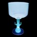 A clear plastic margarita cup with a cactus shaped stem and a blue light on it.