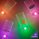 A close-up of a 1.5 oz. customizable plastic champagne shooter with a purple LED light.
