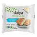 A package of Daiya Vegan Sliced Swiss Cheese on a plate.