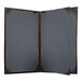 A brown and black H. Risch, Inc. Wine Tuxedo leather menu cover.