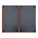 Two brown H. Risch, Inc. leather menu covers with black pages.