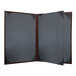 A black menu cover with brown corners.