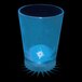 A blue plastic shot cup with a blue LED light in it.