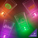 A group of customizable plastic shot cups with pink LED lights.