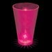 A pink plastic shot cup with a pink LED light inside.