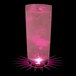 A customizable plastic cup with pink LED light filled with pink liquid and bubbles.