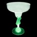 A clear plastic margarita glass with a guitar shaped stem and a green LED light.