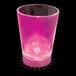 A customizable pink plastic shot cup with a pink LED light.
