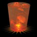 A 12 oz. plastic rocks cup with ice and a glowing light.