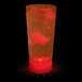 A customizable plastic cup with red LED light filled with a drink and ice cubes.