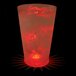 A customizable plastic pint cup with a red LED light inside filled with red liquid.