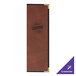 A brown leather H. Risch, Inc. menu cover with black text on a table.