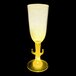 A yellow plastic champagne cup with a yellow LED light on a black background.