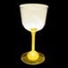 A close-up of a customizable plastic wine cup with a yellow LED light on it.