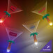 A table with three customizable palm tree stem martini glasses with blue LED lights.