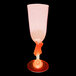 A wine glass with a guitar on the stem.
