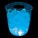 A customizable plastic champagne bucket with blue LED lights and ice inside on a table in a cocktail bar.