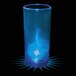 A close up of a blue plastic champagne shooter with a blue LED light in it.