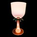 A close up of a 14 oz. plastic palm tree stem goblet with an orange LED light inside.