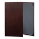 A brown leather H. Risch, Inc. menu cover with picture corners.