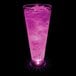 A customizable plastic pilsner cup with a purple LED light filled with a pink drink and ice cubes.