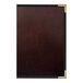 A close-up of a brown leather H. Risch, Inc. Wine Tuxedo menu cover.