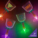 A group of customizable plastic wine cups with palm tree stems and orange LED lights.