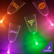 A close-up of a customizable plastic guitar stem champagne cup with a green LED light.