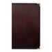 A brown leather H. Risch, Inc. Wine Tuxedo menu cover with black trim.