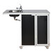 A Monsam black wheelchair accessible portable sink with a faucet on wheels.