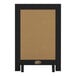 A black magnetic chalkboard with a black frame and metal scrolled legs.