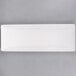 A rectangular white plate with long edges.