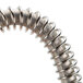 A close-up of the double-sided metal spring on an American Metalcraft sign clip.