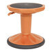 A Flash Furniture orange kid's adjustable stool with a black base.