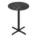 A Holland Bar Stool EuroSlim black marble round bar table with a black metal base.