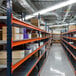 An Interlake Mecalux blue and orange bulk rack starter with steel decking on shelves.