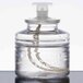 A clear plastic bottle of Sterno Soft Light clear liquid candle fuel with a white lid.