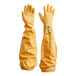 A yellow bag with a pair of yellow Showa rough grip gloves with black writing on it.