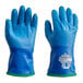 A pair of blue Showa TEMRES thermal insulated gloves with white palms and green trim.