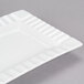 A CAC Queensquare bone white rectangular porcelain platter with a curved edge.