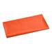 A folded red rectangular plastic table cover in a plastic bag.