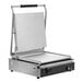 A Vollrath stainless steel panini grill with smooth plates.