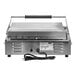 A silver Vollrath panini grill with a black handle and cord.