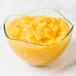 A bowl of Oregon Fruit Mango Filling on a table.