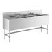 A Regency stainless steel underbar sink with four bowls, two drainboards, and two faucets.