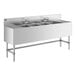 A Regency stainless steel underbar sink with four bowls, two drainboards, and two faucets.