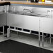 A Regency stainless steel underbar sink with a right drainboard.