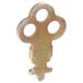 A metal key for a C-Fold paper towel dispenser with four holes.