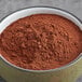 A bowl of Cacao Barry Dutched cocoa powder.